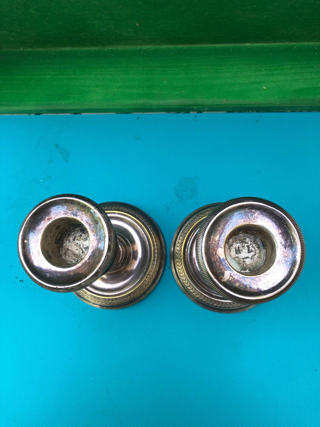 Pair of Louis XVI style candlesticks in silvered bronze