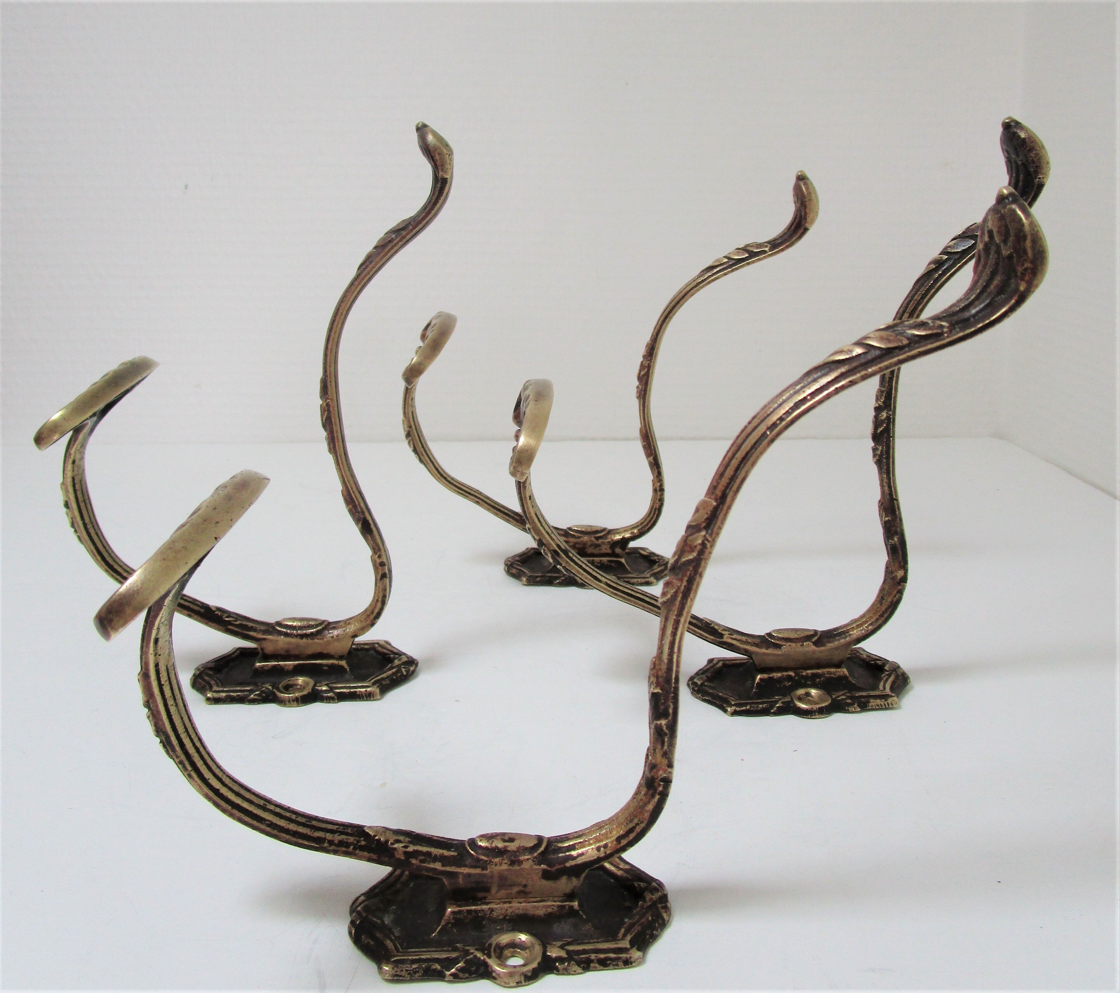 Four patères bronze patinated leafy décor early 20th century