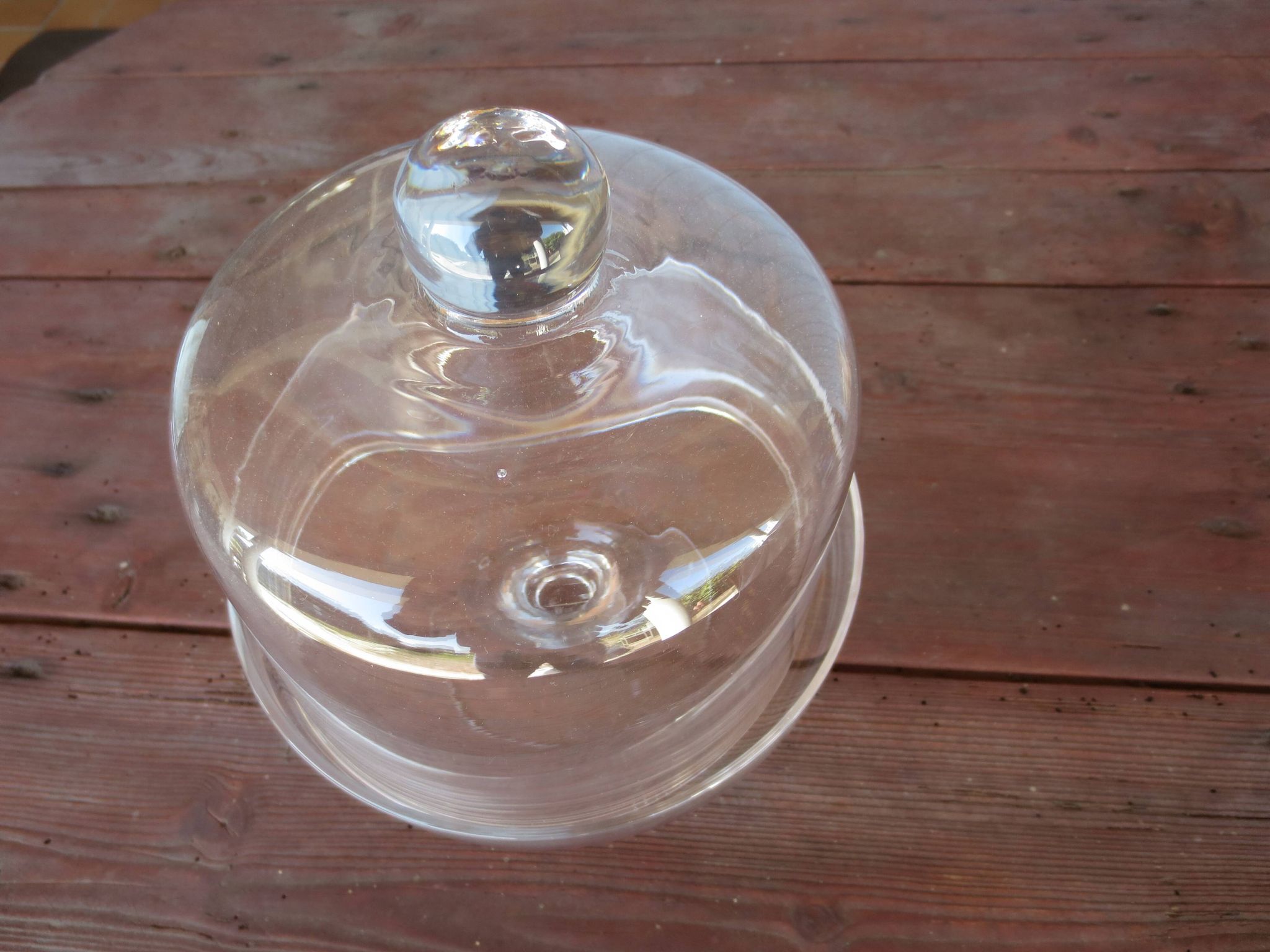 Old glass cake dome on a stand