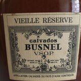 Bottle of Calvados labeled in sandstone