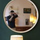 Large vintage circular mirror, plastic frame.
