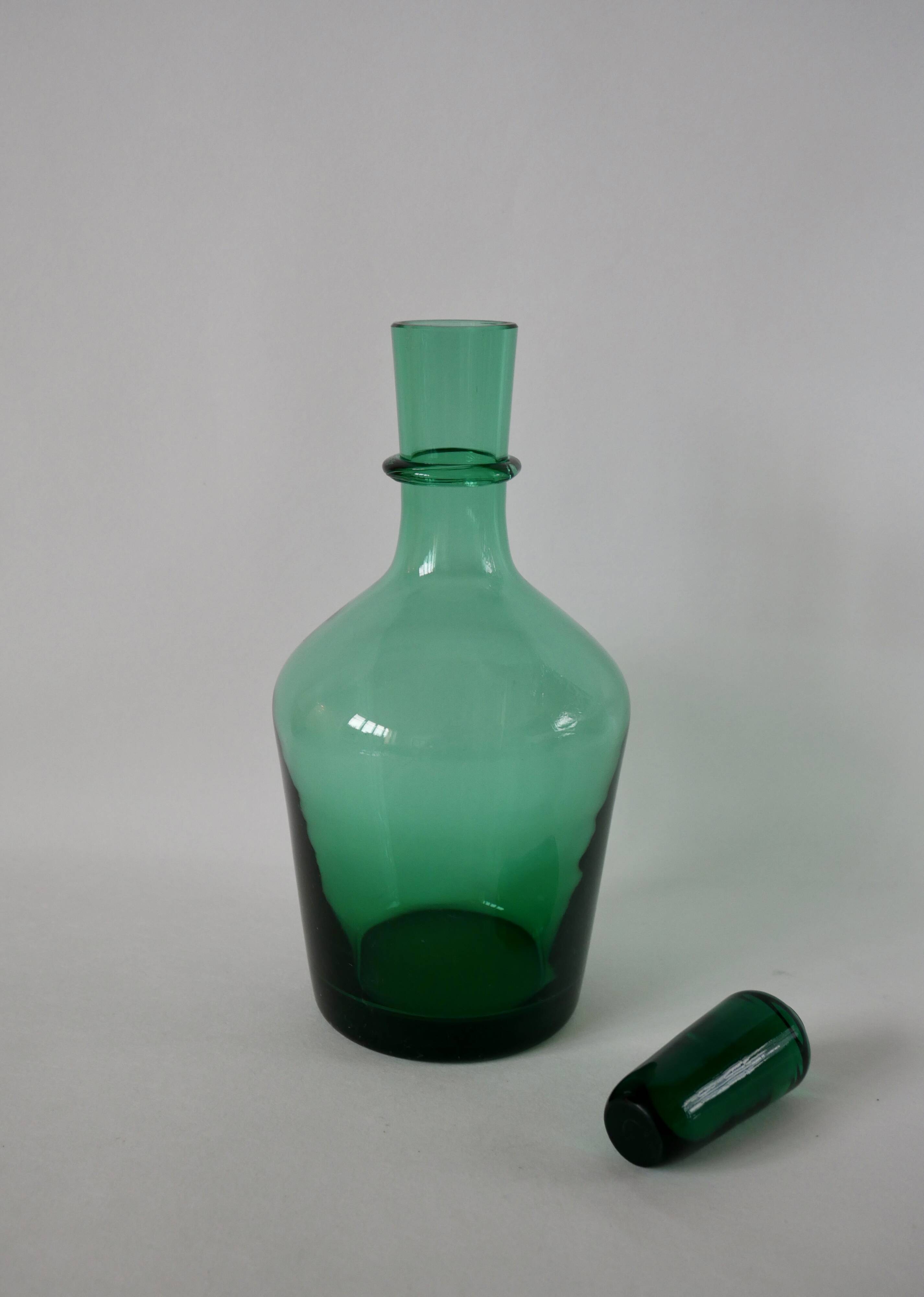 Set of a carafe and 4 designer glasses in green glass from the 70s