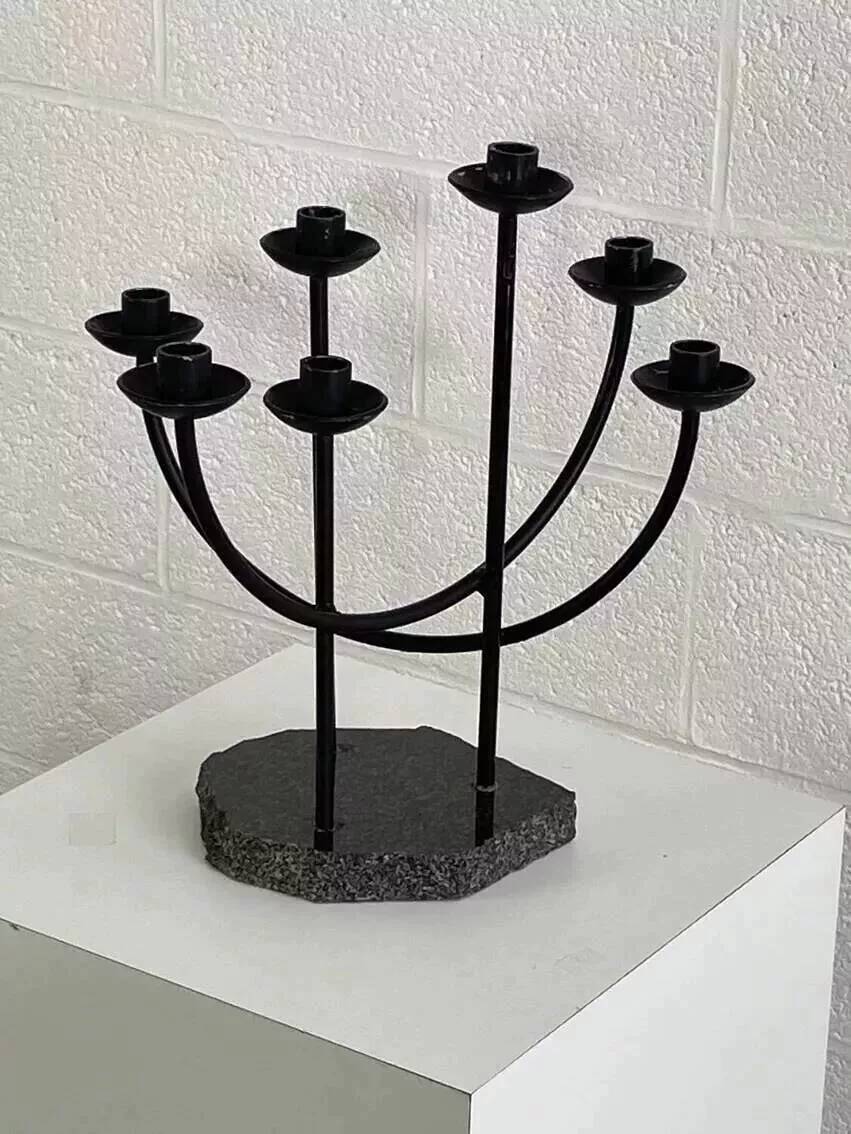 Metal candle holder and black quartz base