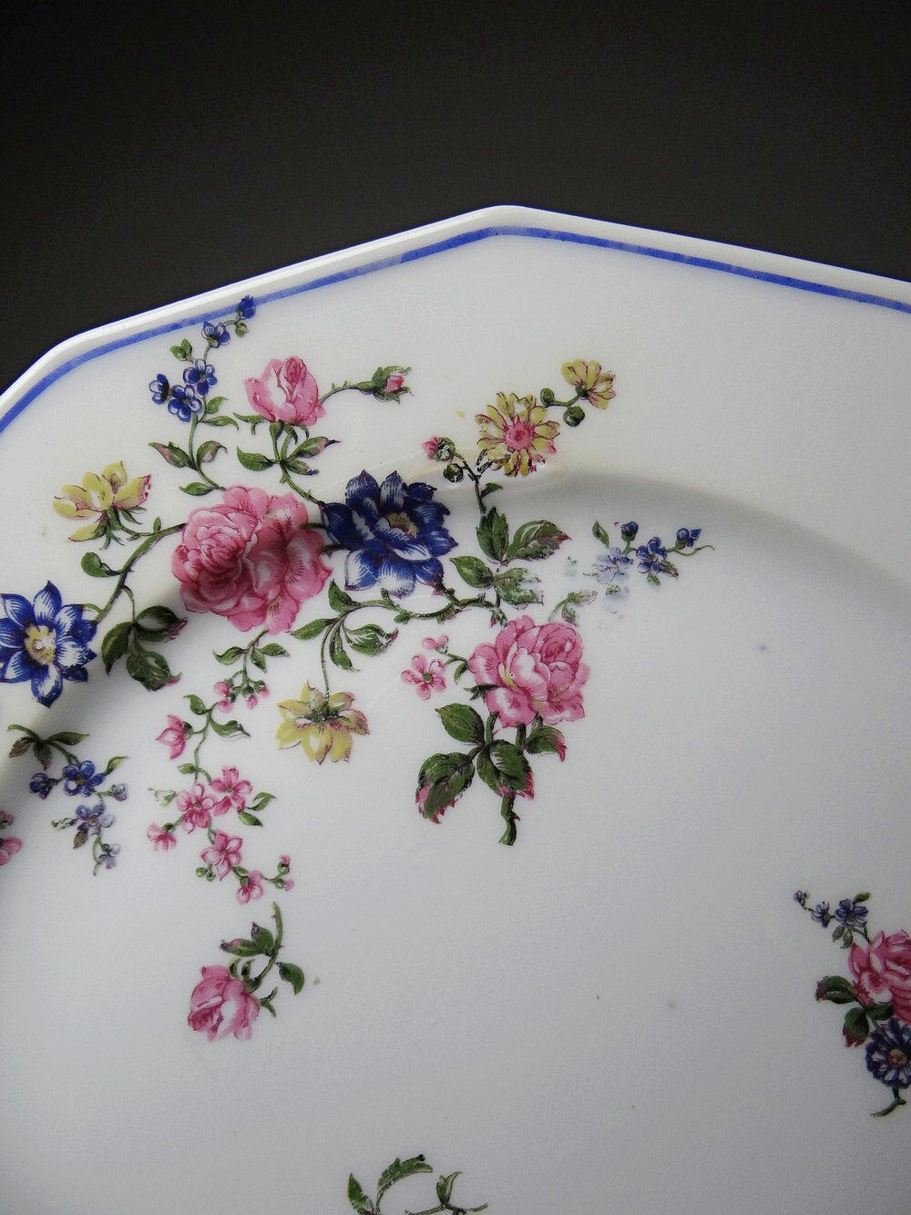4 flat plates by Bernardaud, Limoges porcelain, floral decoration from the 1920s to 1950s.