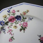 4 flat plates by Bernardaud, Limoges porcelain, floral decoration from the 1920s to 1950s.