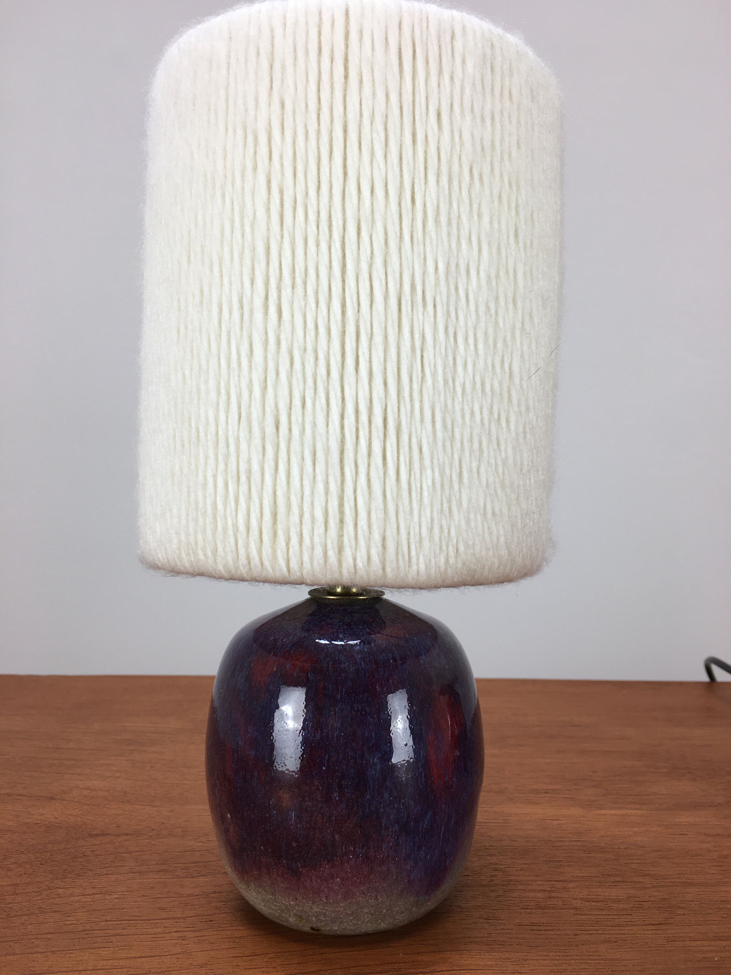 Pair of ceramic sandstone ball lamps and wool lampshades