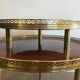 Tripod gueridon in neoclassical style made of mahogany, brass, and a golden metal base.