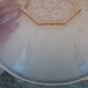Art Deco plate in moulded pressed glass with a daisy pattern.