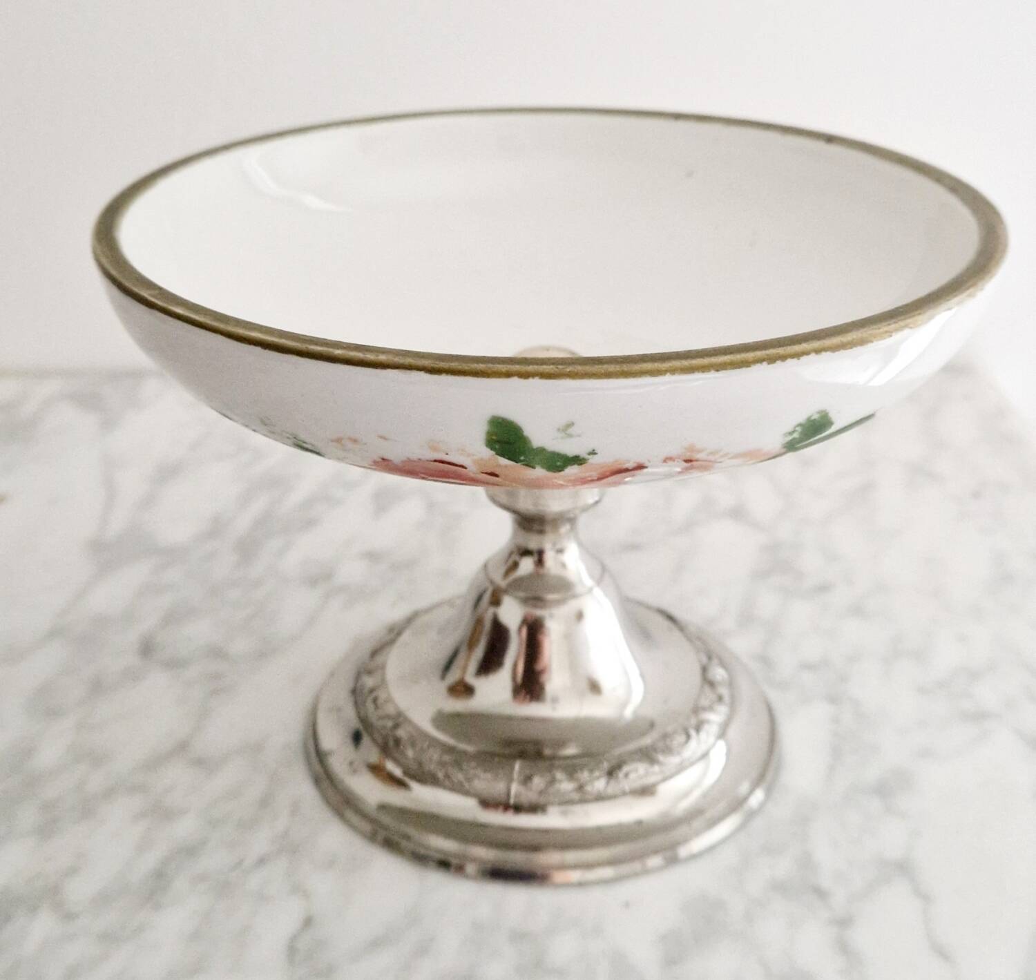 Porcelain cup on silver metal foot
