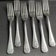 6 Christofle America forks numbered George V