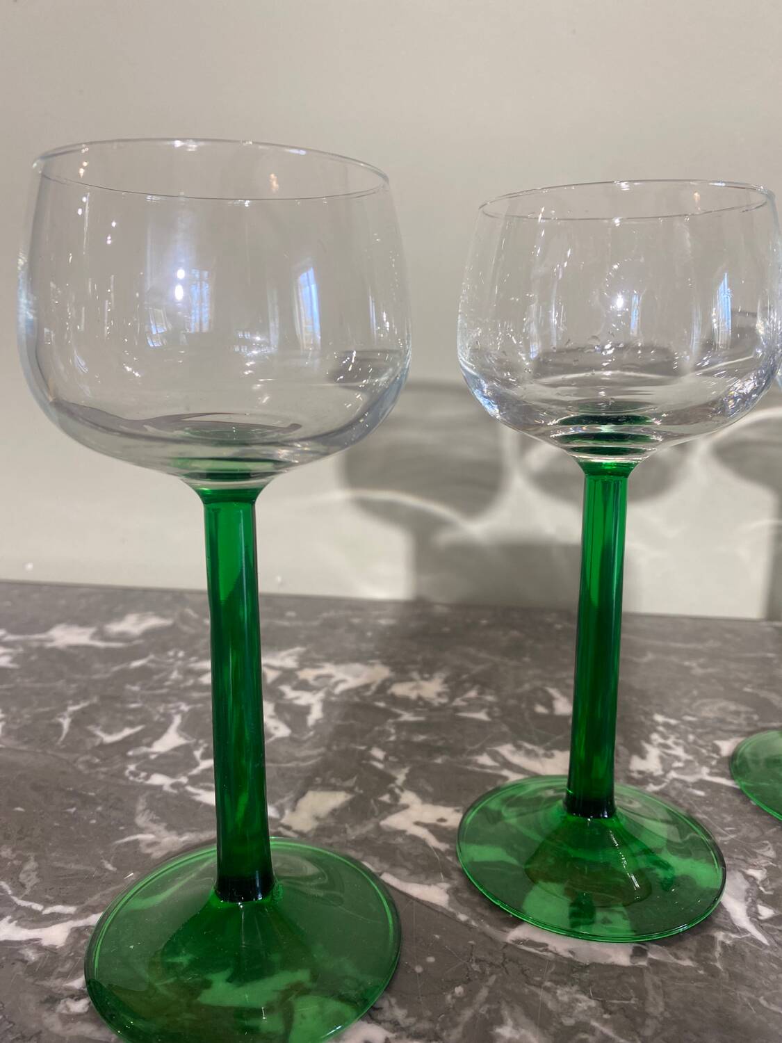 4 green stemmed glasses