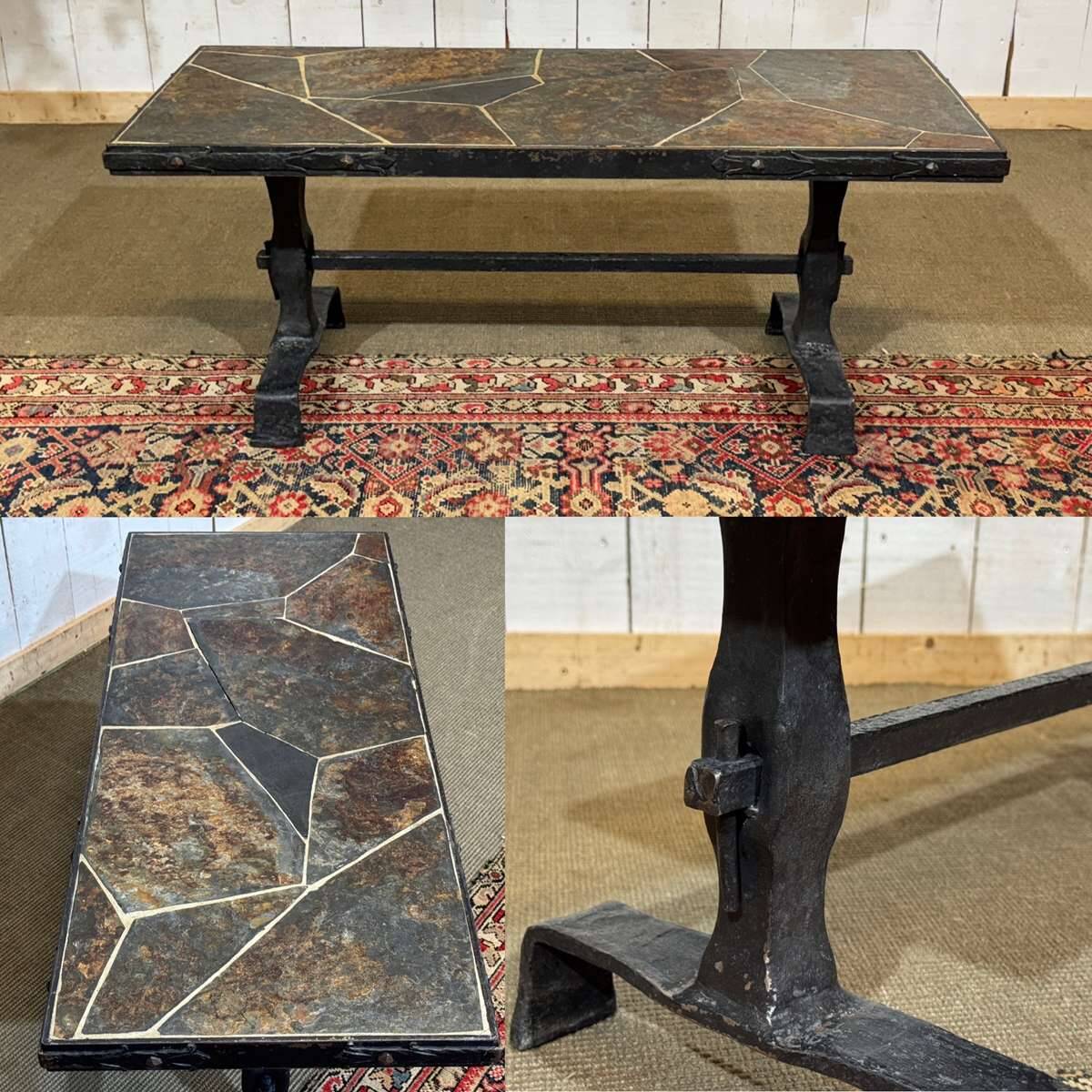 Coffee table in wrought iron with a slate top, work from the 1950s.