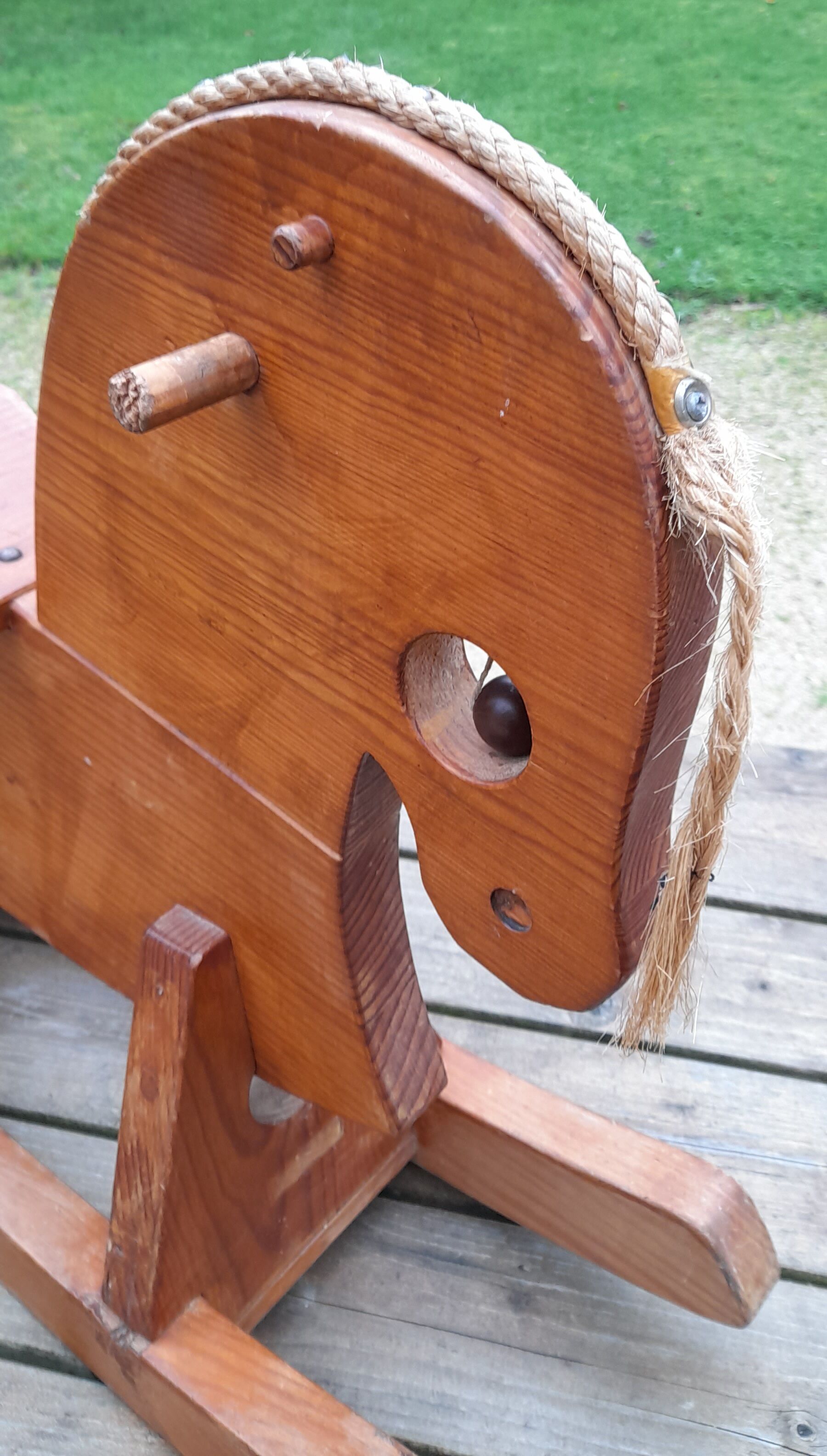 Rocking horse in raw and glazed wood