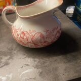 Old pitcher in red-decorated earthenware.