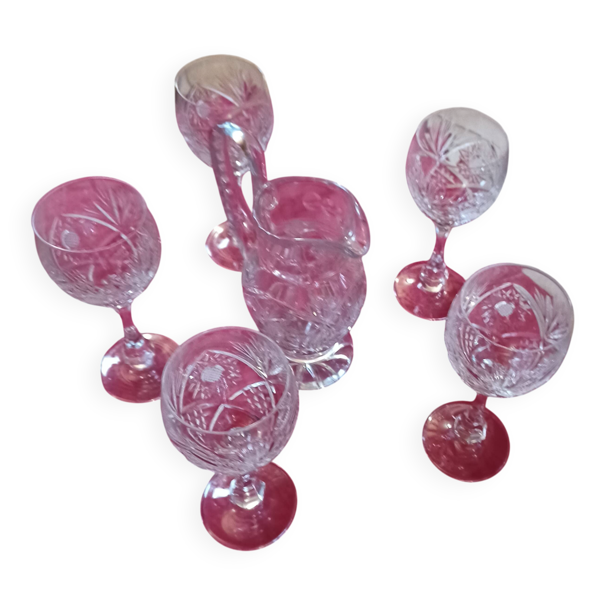 Crystal wine glasses cut by Baccarat with a jug.