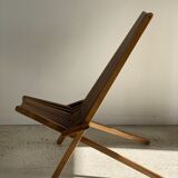 Foldable designer armchair in wooden slats