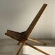 Foldable designer armchair in wooden slats