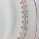 Plat rond ancien en céramique opaque blanc et or made in france Digoin