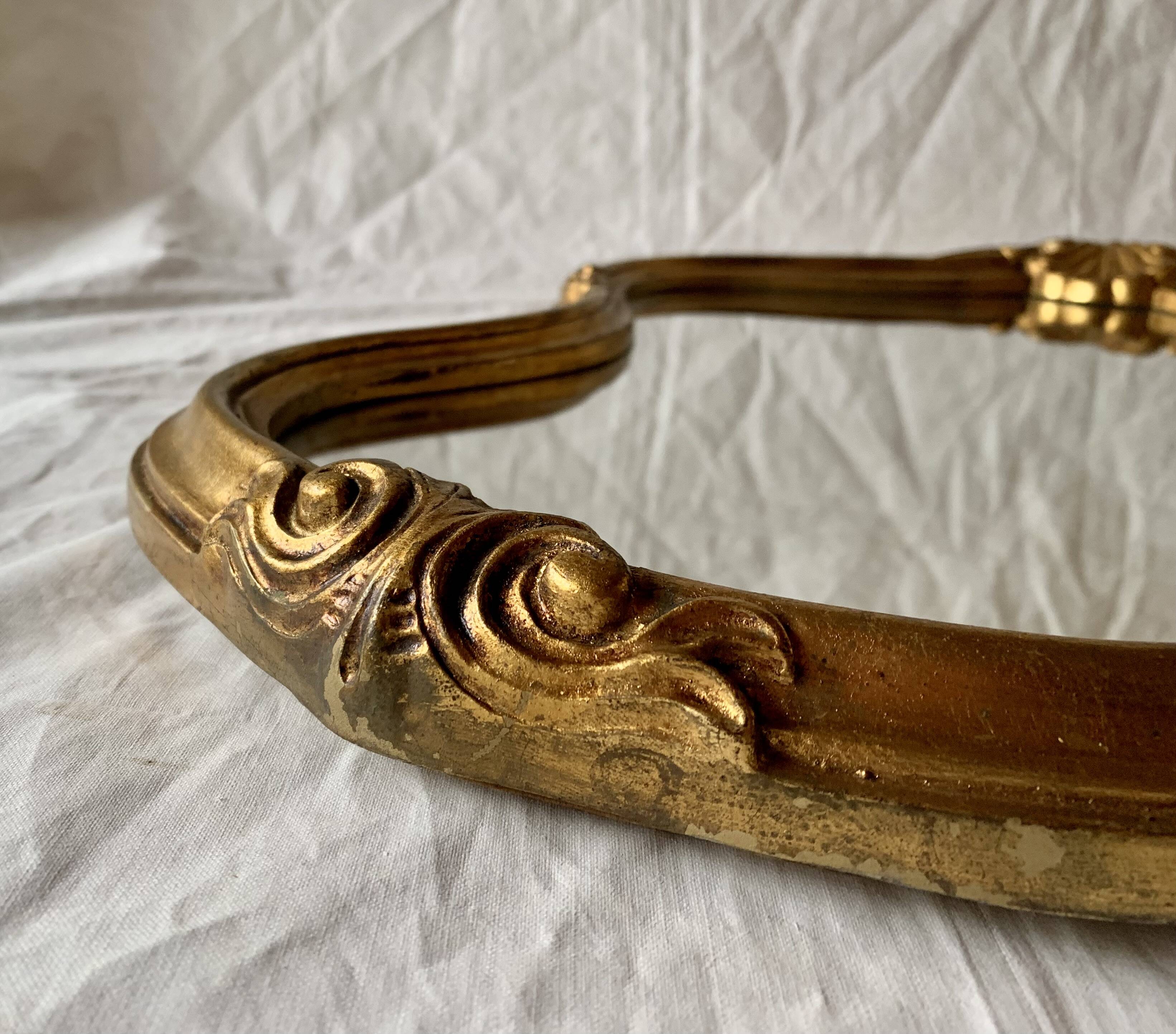 Large rococo mirror in gilded wood