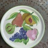 Decorative plate to hang, fruit model, in enamelled ceramic, Les Fruits, signed Luciano