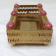 Golden metal catchall with pink stones