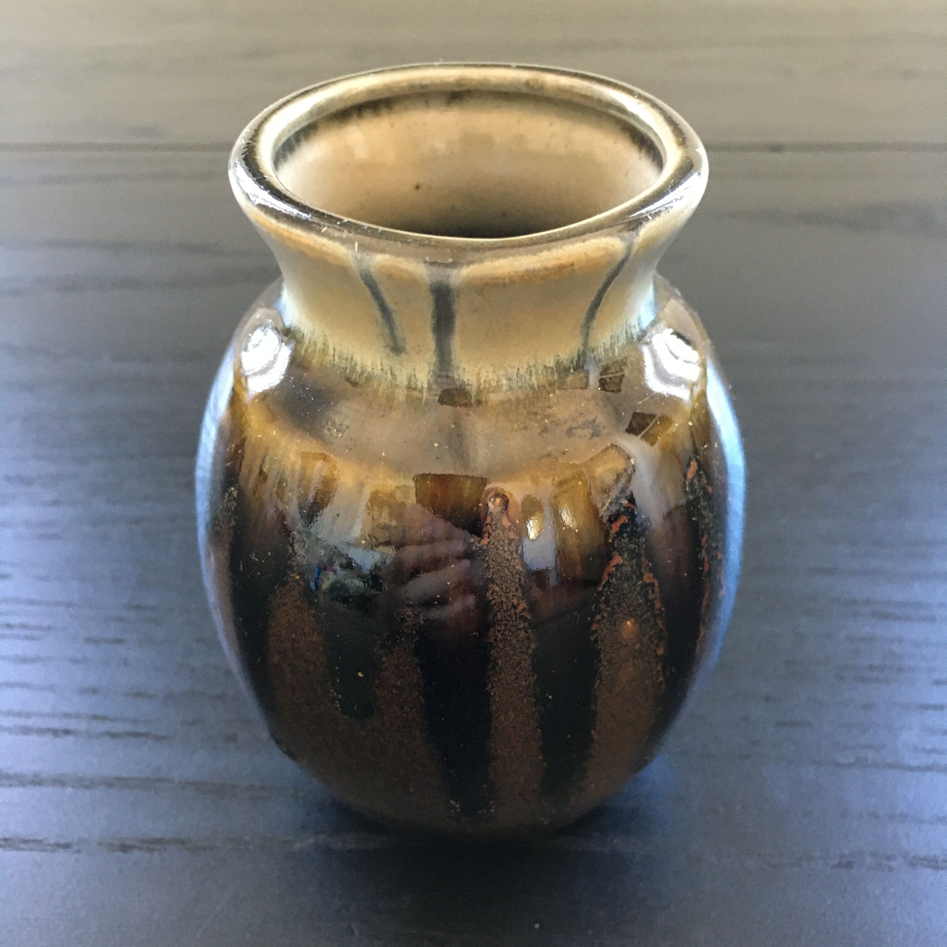 Brown and black flame-colored vase