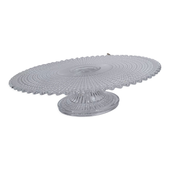 Transparent molded glass pie dish on foot