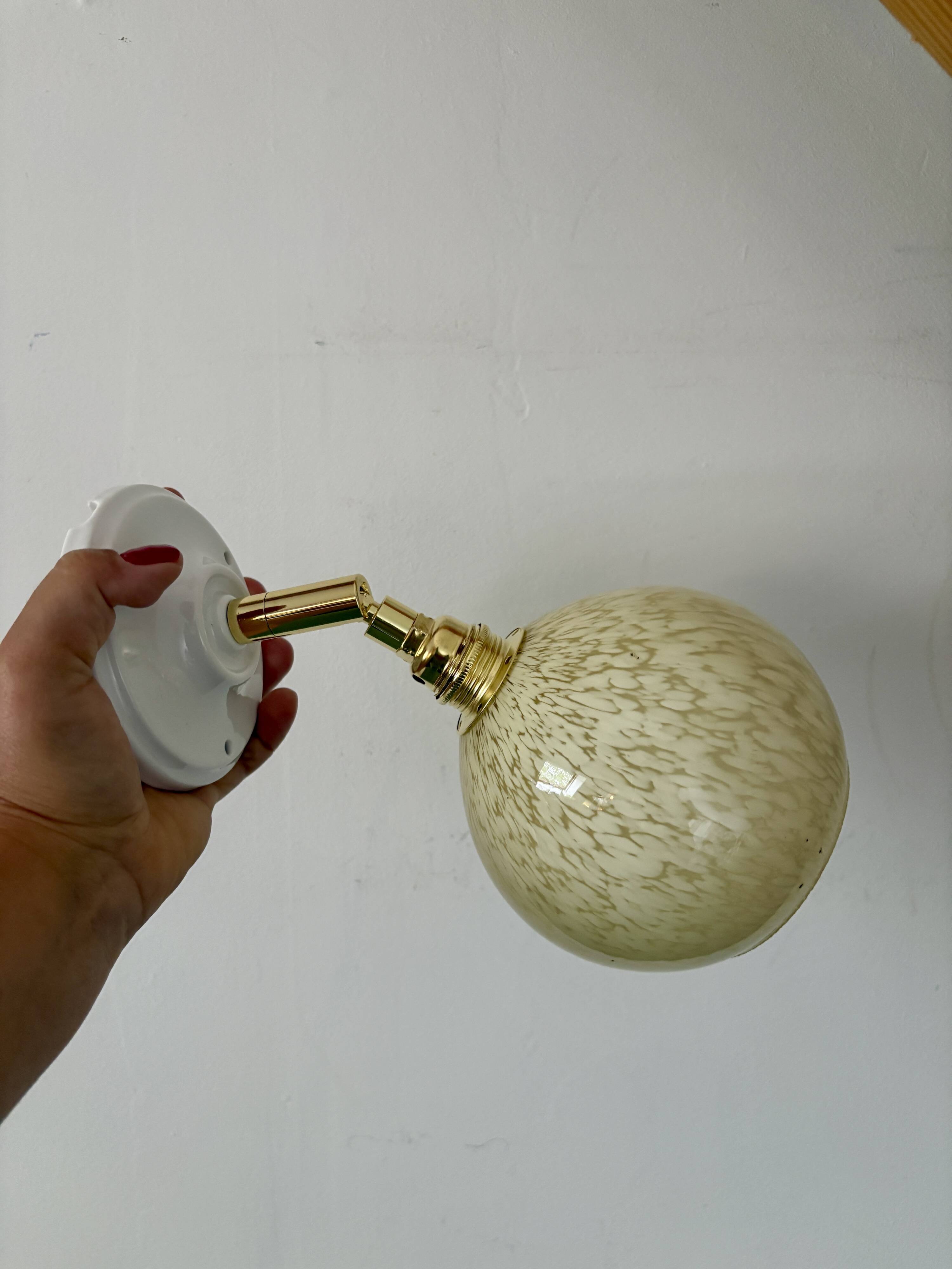 Vintage glass globe wall light in pale yellow from Clichy.