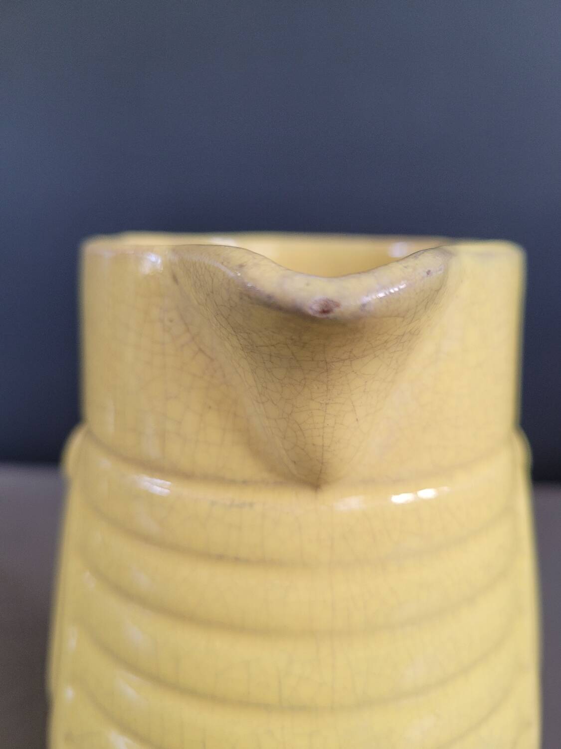 Yellow milk jug with reliefs