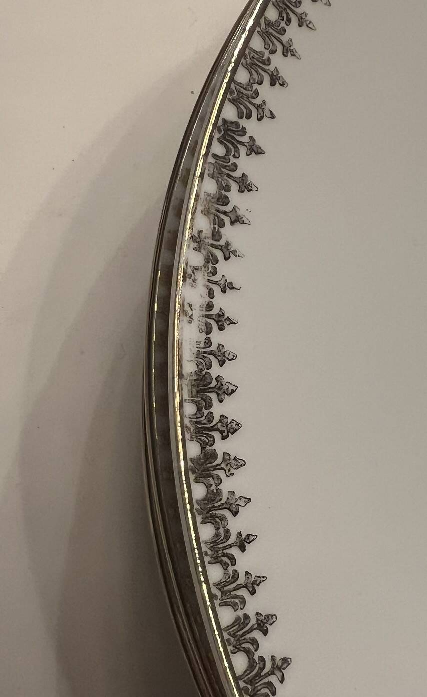 24 plates and a vintage porcelain dish decorated by Lucien Engel.