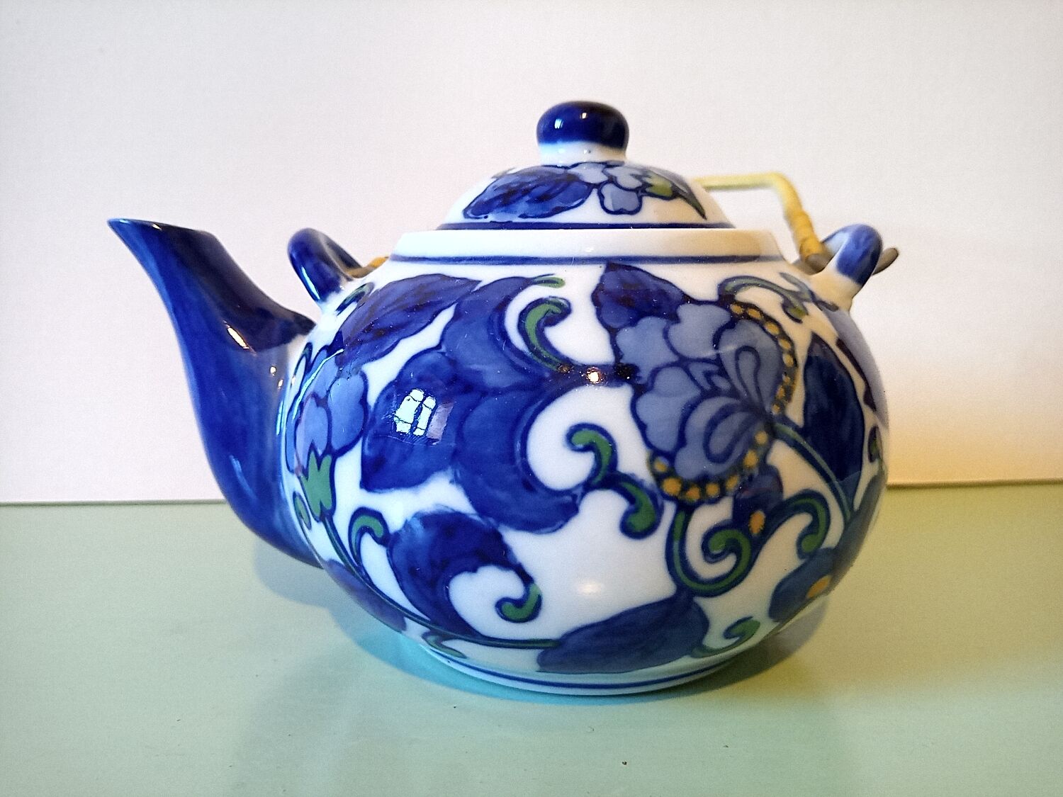Hand-painted blue floral pattern teapot