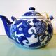 Hand-painted blue floral pattern teapot