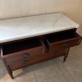 Louis XVI style commode with a shaped marble top.