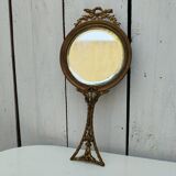 Mirror face to hand gilded bronze knot ribbon