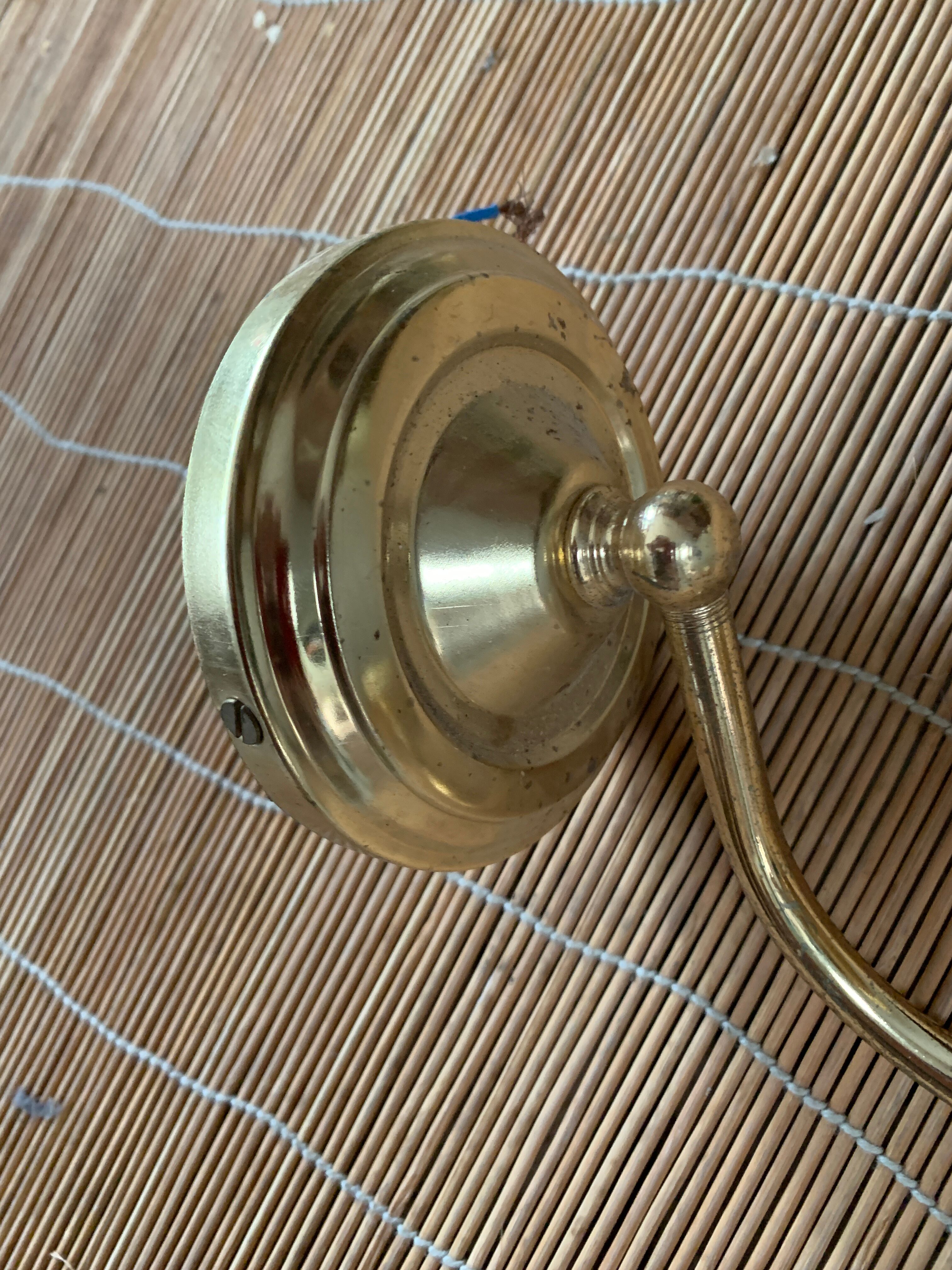 Brass and glass sconce