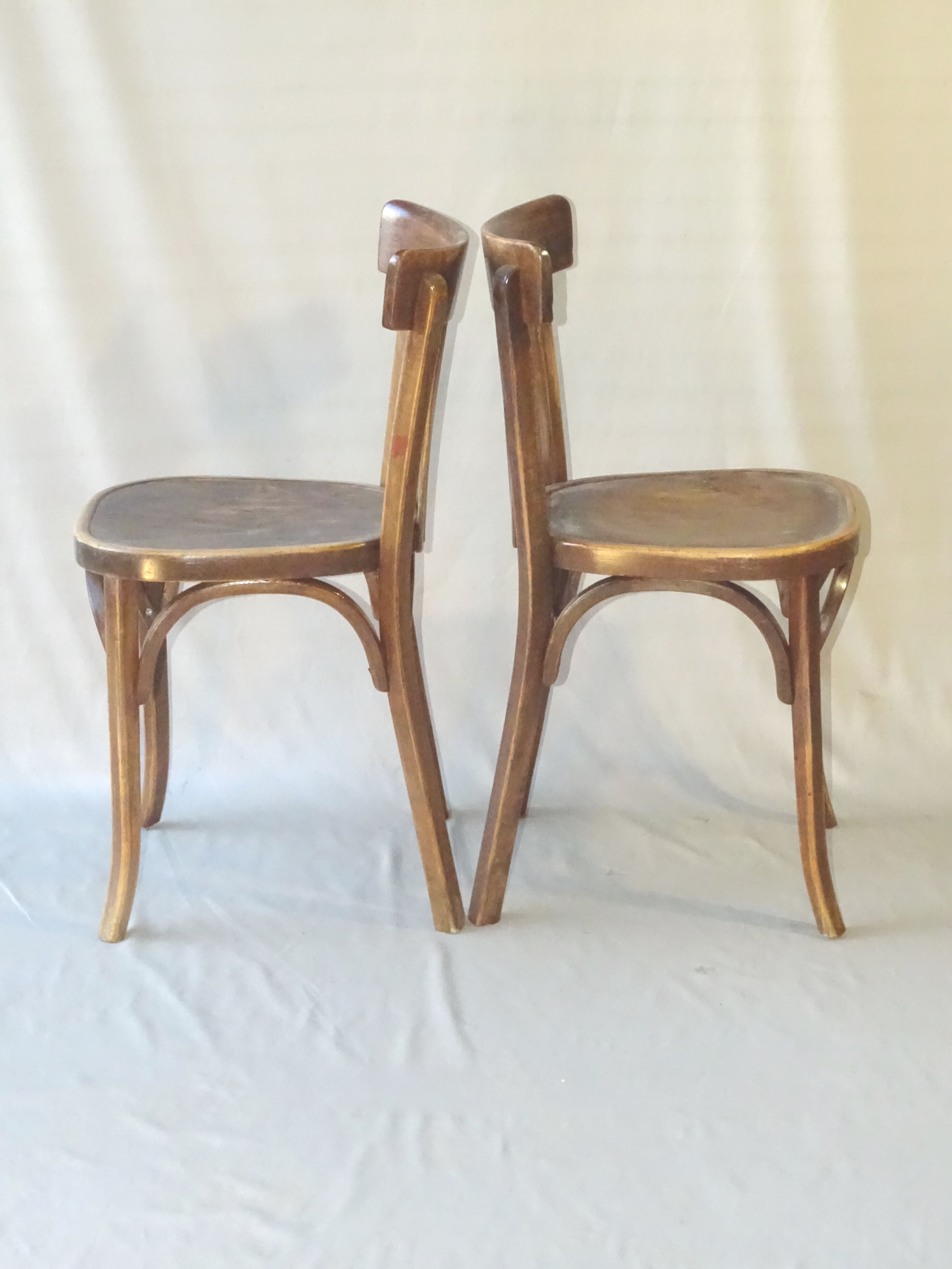 Paire de chaises bistrot Baumann 1955 assise bois