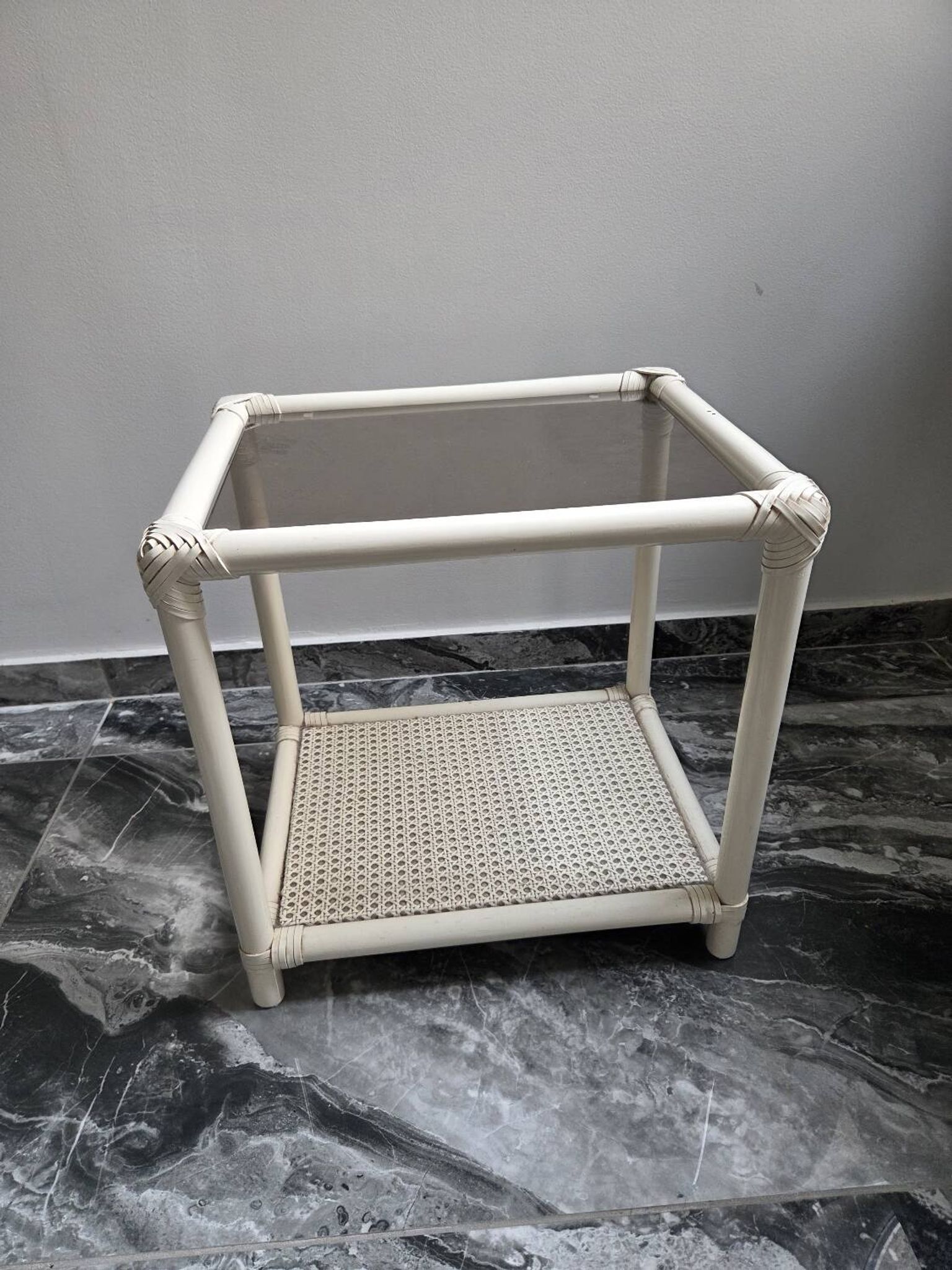 Rattan and cane side table with tinted glass top