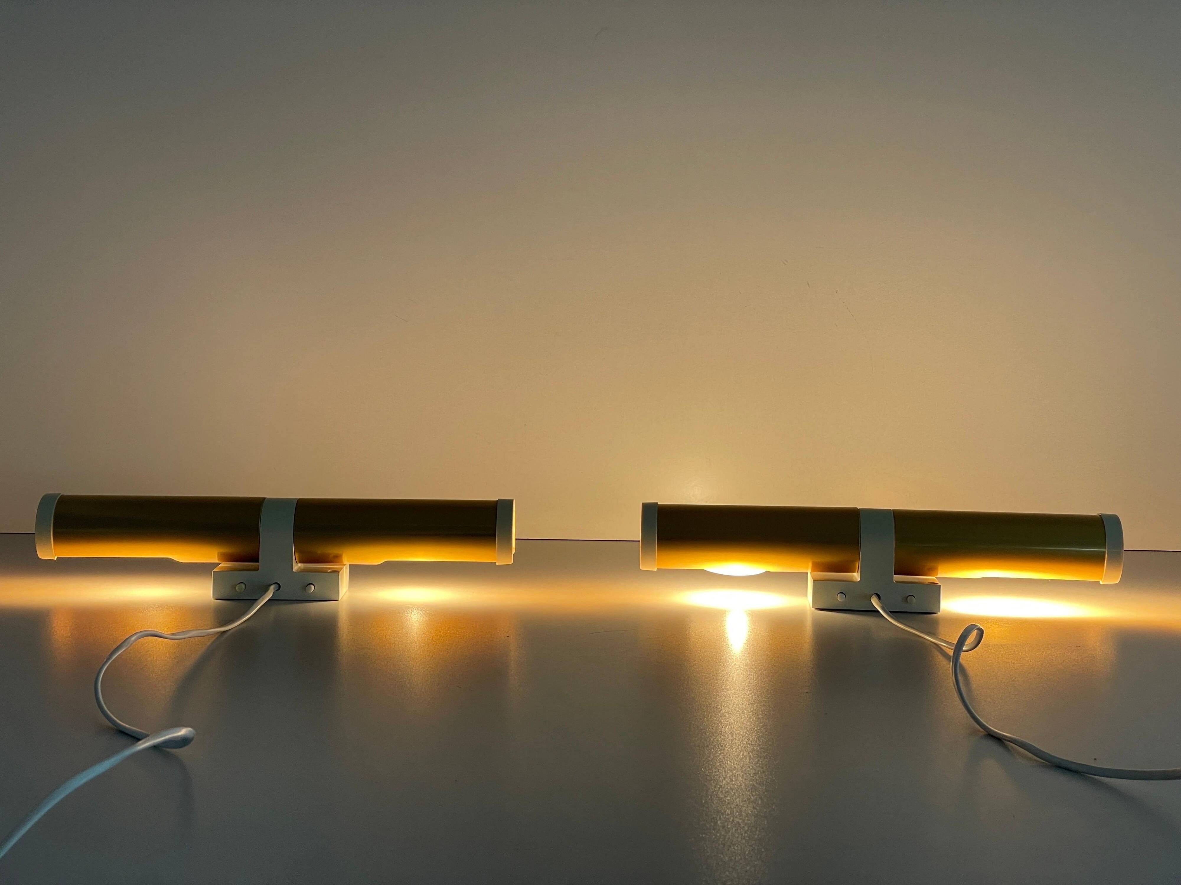 Pair of two-headed wall sconces in gold metal by ERCO, 1970s, Germany
