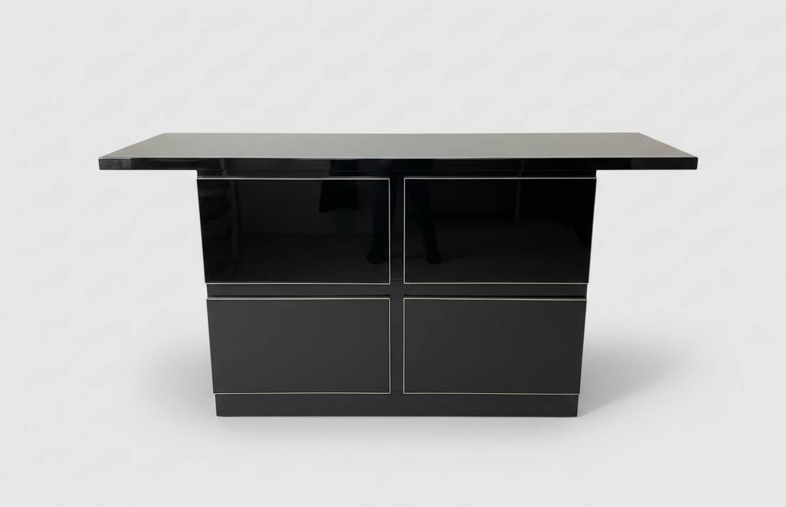 Black lacquered 4-drawer cabinet by David Lange with a lacquered top.