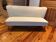 Mid-Century 1950s style two-seater canapé with cream fabric and solid beech.