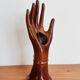 Hand wears brown jewelry , ring, soliflore , vintage French , 50s