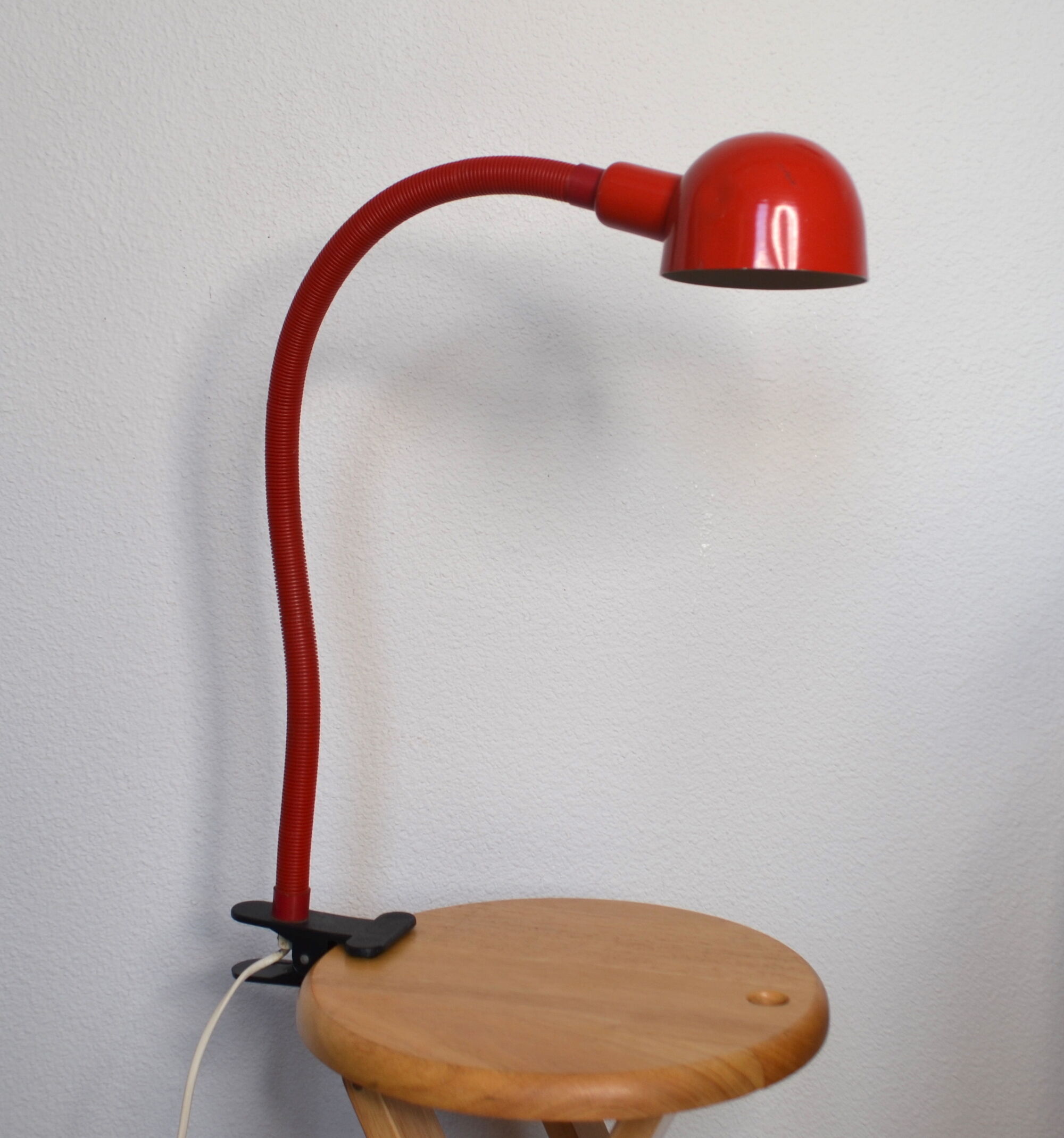 Red articulated clip-on desk lamp vintage
