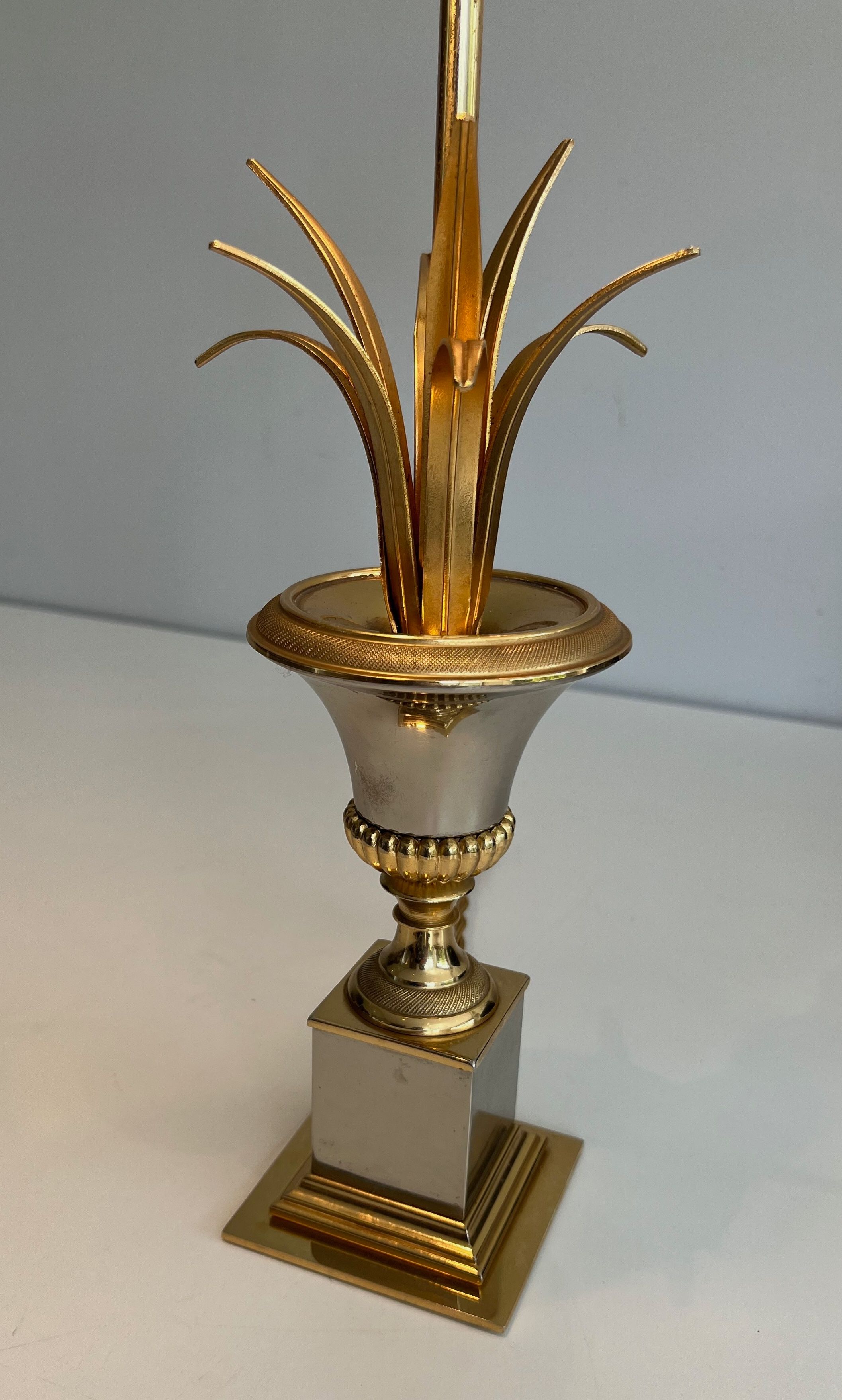 Pair of palm lamps in chrome and brass in the style of Maison Charles. Circa 1970.