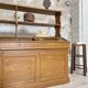 Wooden hardware cabinet painted with wood effect, circa 1940.
