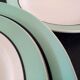12 service plates and 1 green plate mint