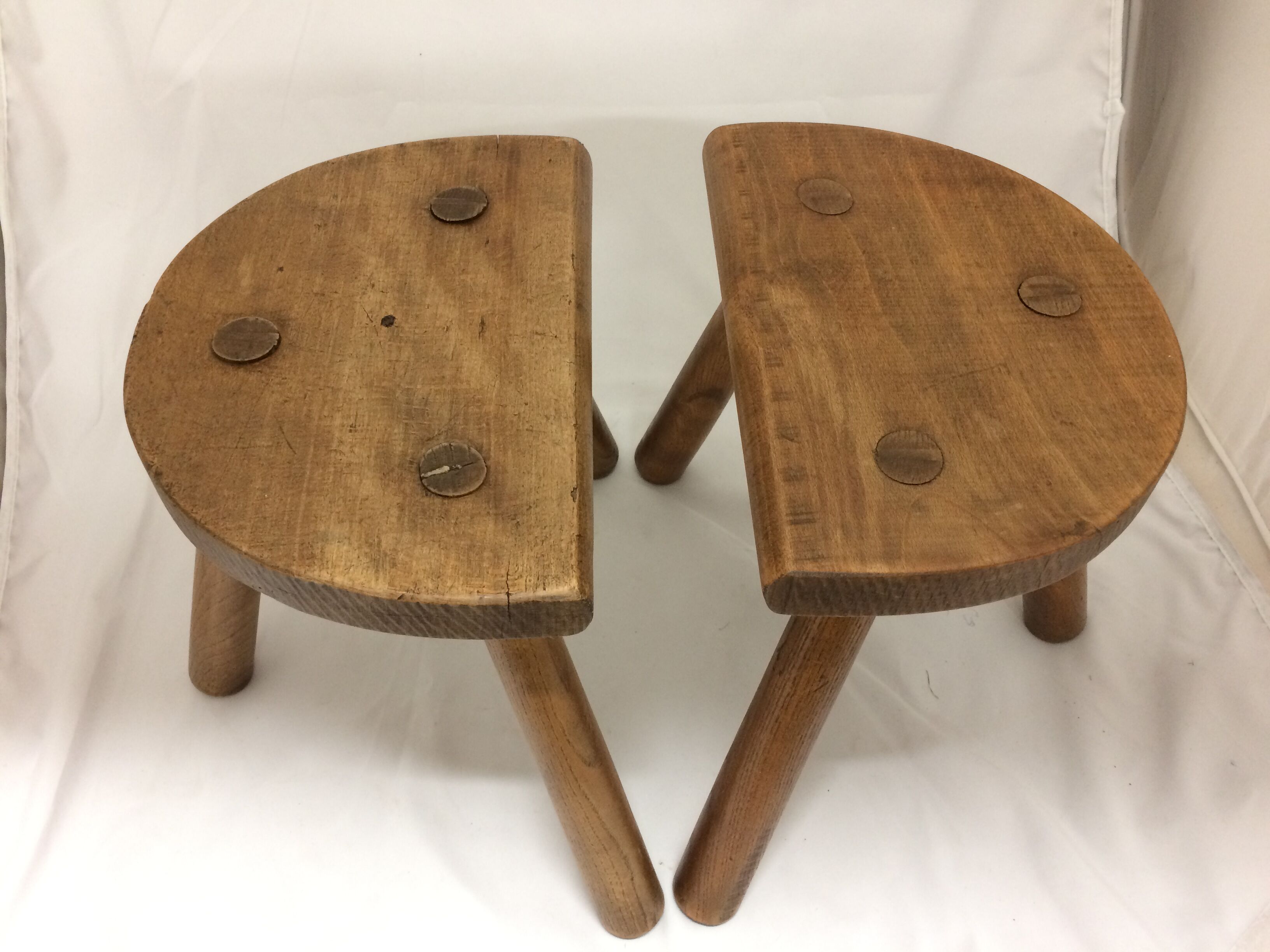 pair of old farm tripod stools