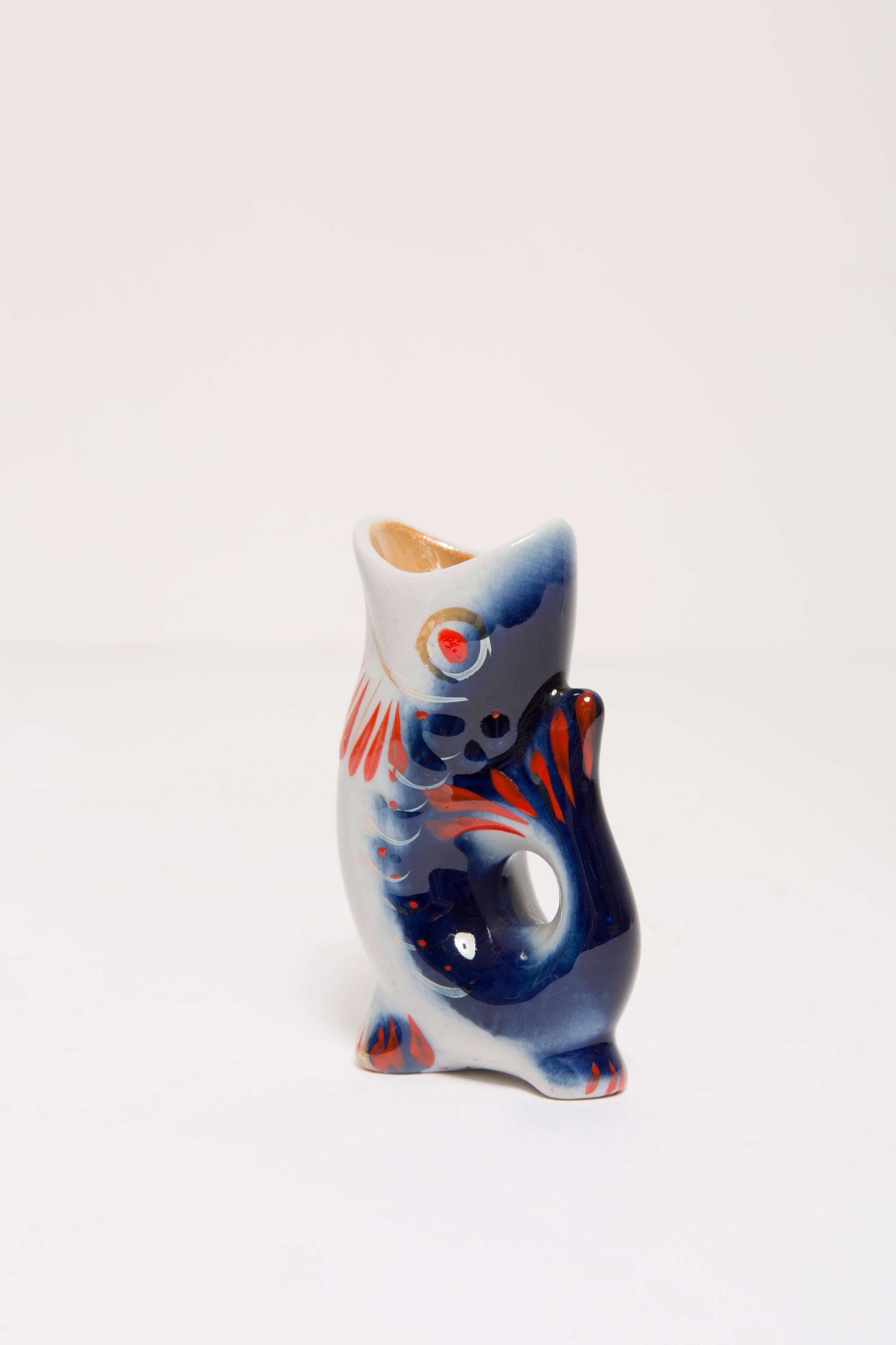 Set of 7 blue glass fish, mid-20th century.