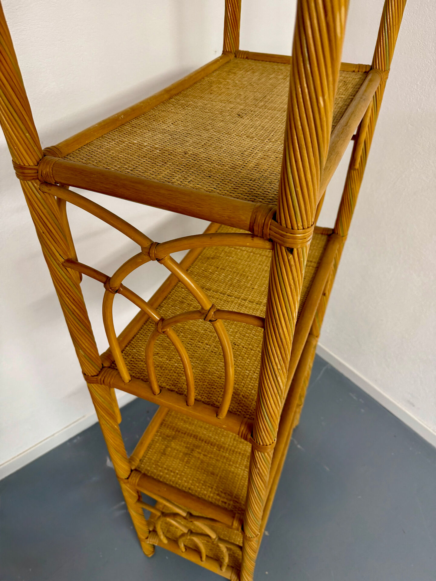 Large woven rattan bookshelf designed in the 1970s.