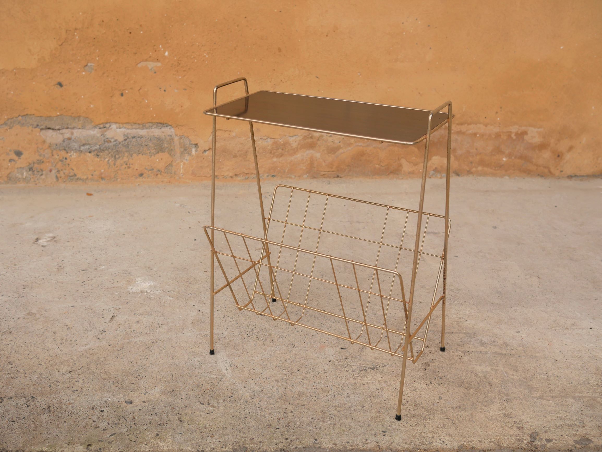 Vintage gold metal magazine rack