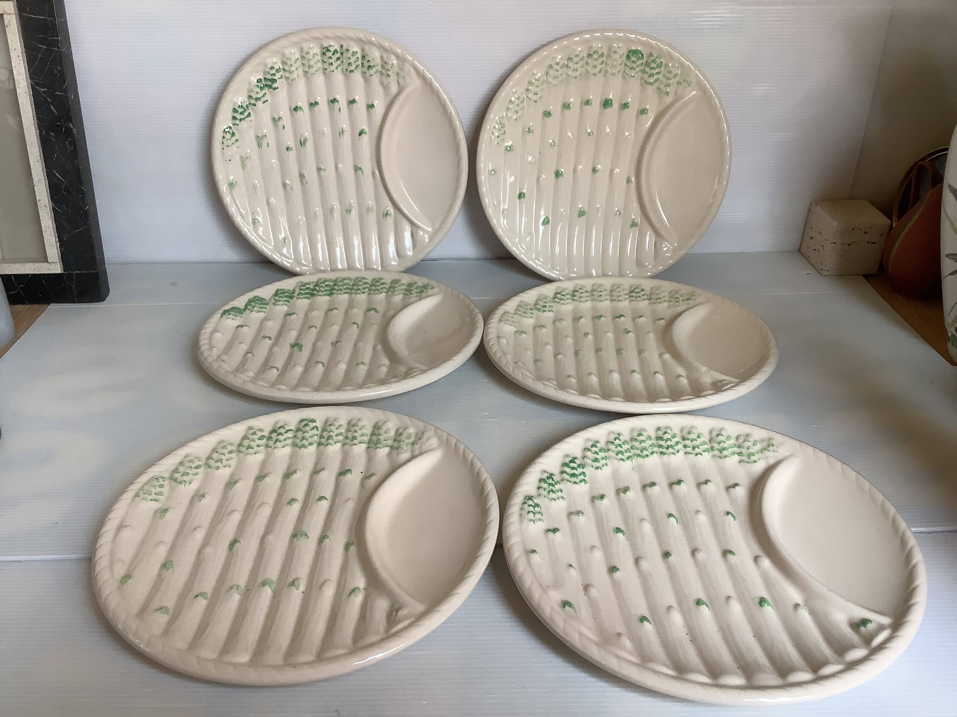 Six antique asparagus plates
